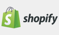 Shopify logo with green shopping bag icon and text.