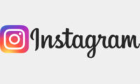 Instagram logo with a pink heart icon on a light background.