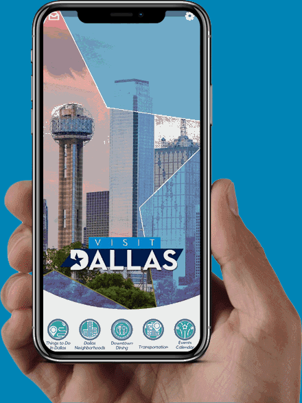 A hand holding a phone displaying a Dallas skyline app interface.